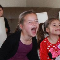 Children laughing during a Jimmy Marvel magic show